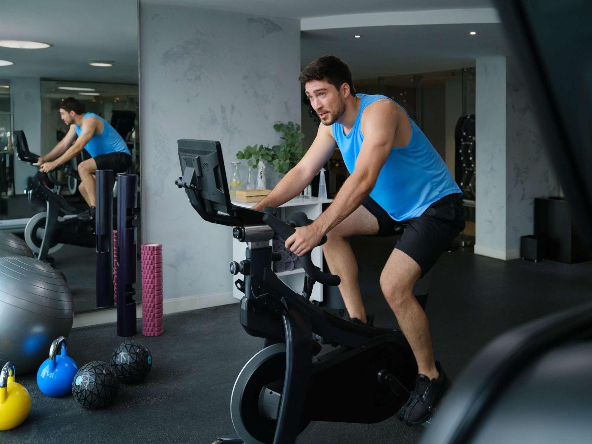 Pullman Jakarta Central Park Экстерьер фото A man on a stationary bicycle